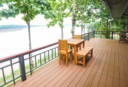 vecteezy_wooden-table-and-chairs-on-balcony-and-nature-green-tree_7764473_742Cropweb.jpg